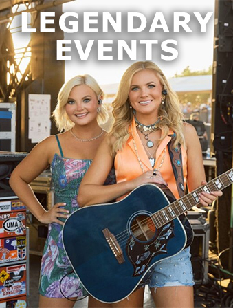 Two blonde women on stage as one holds a blue guitar, with overlay text that reads: Legendary Events