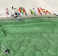 kayakers anchored on the shore