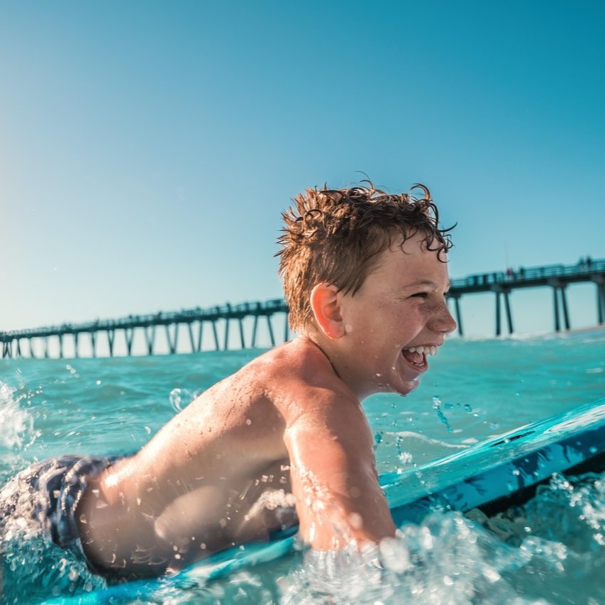 Kid skimboarding in Venice