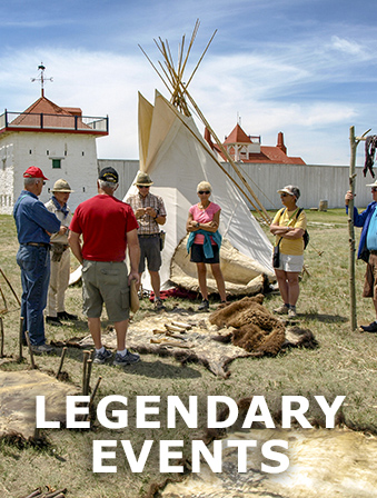 Group of people looking at animal skins and a tipi, with overlay text that reads: Legendary Events