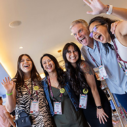 Five enthusiastic event marketers pose for a photo at CEMA Summit 2025 in Austin, Texas