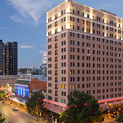 The brick facade of The Stephen F. Austin Royal Sonesta Hotel in downtown Austin, Texas