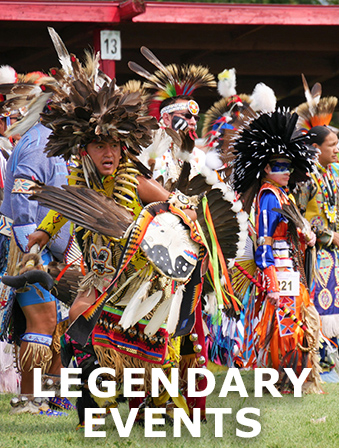Indigenous people dressed in traditional clothing decorated with feathers and bright fabrics, with overlay text that reads: Legendary Events