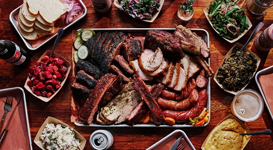 Micklethwait Craft Meats' barbecue platter features brisket, ribs, sausage and poultry in Austin, Texas