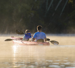 dad and son paddling in sarasota