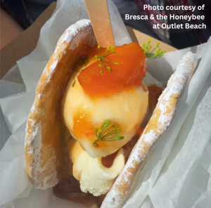 Fresh ice cream and fruit in a cone
