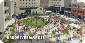 Aerial view of a public green space with market tents set up surrounded by buildings, with overlay text that reads: @redrivermarket