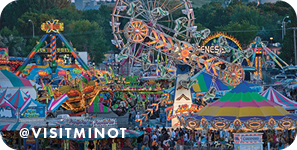 View of colorful rides at a fair, with overlay text that reads: @visitminot