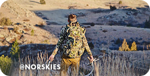 View from behind of a man wearing camouflage and carrying hunted birds, with overlay text that reads: @norskies