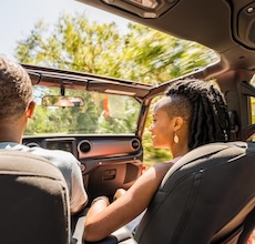 couple driving through myakka river state park