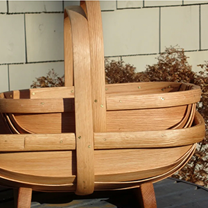 Two hand-made trugs stacked on a table