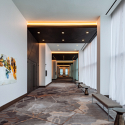 Looking down a hallway and pre-function event space inside the Austin Marriott Downtown in Austin, Texas