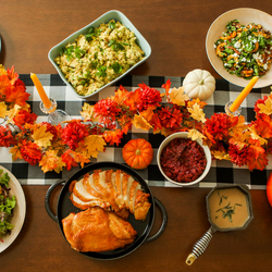 Thanksgiving meal with roasted turkey, stuffing, side dishes and fall decorations at the Fairmont Austin in Austin, Texas