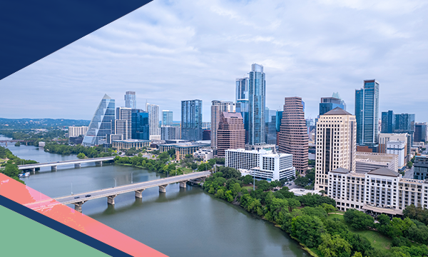  Aerial view of the Downtown Austin skyline looking across Lady Bird Lake and two bridges over the water