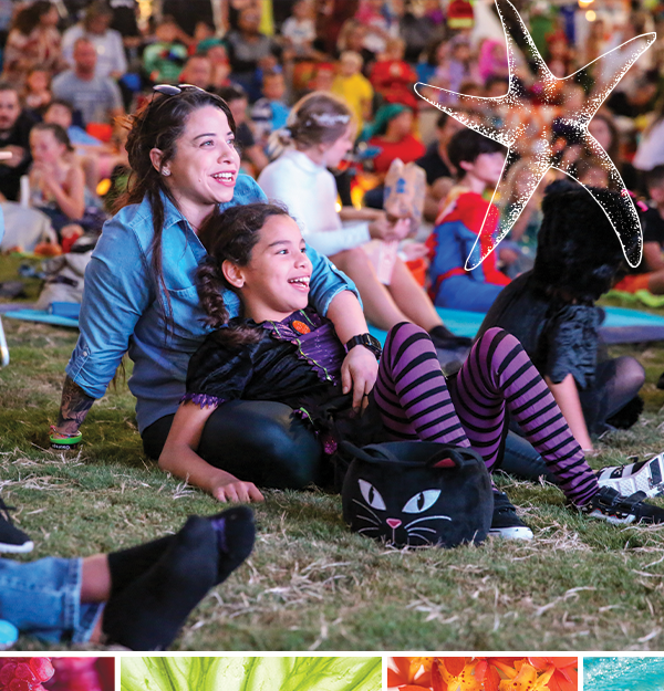 mom and daughter watching halloween movie in the bay park sarasota
