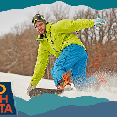 Man wearing a bright green coat and blue pants riding a snowboard through snow, with overlay text that reads: Hello North Dakota