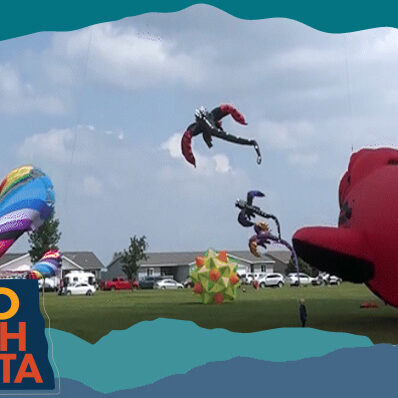Kites flying at a festival, with overlay text that reads: Hello North Dakota