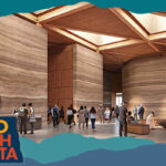 Interior of the Theodore Roosevelt Presidential Library featuring people in a lobby with a stone and wood design, with overlay text that reads: Hello North Dakota