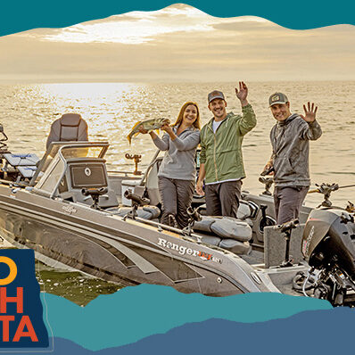 Two men and a woman standing on a boat on a lake waving and holding up caught fish, with overlay text that reads: Hello North Dakota