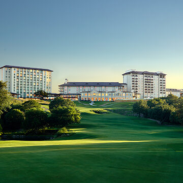 Rolling green hills and a golf course encircle the luxurious Omni Barton Creek Resort & Spa in Austin, Texas