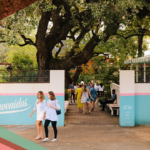 Two woman leave the courtyard patio as other patrons gather at Fresa’s South First in Austin, Texas